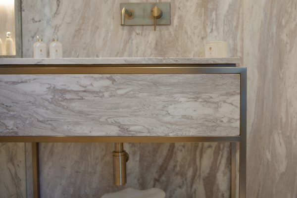 Cherwell Metal Works marble bathroom counter top at Regal London Dubai, Luxury marble and metal work washbasin.